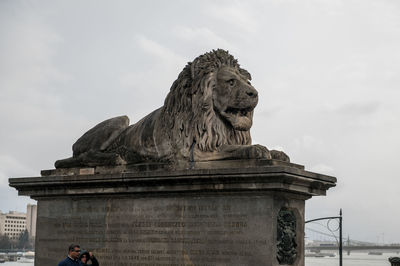 Low angle view of statue against cloudy sky