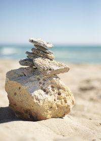 Pyramid of stones on the background of the sea.