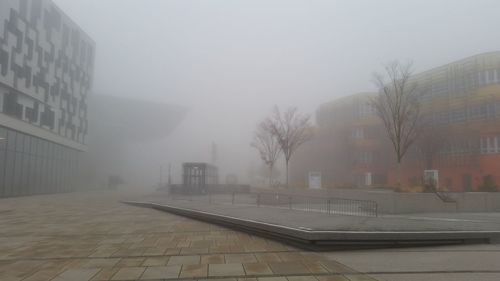 View of skyscrapers in foggy weather