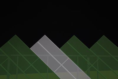 Low angle view of abstract pattern against black background