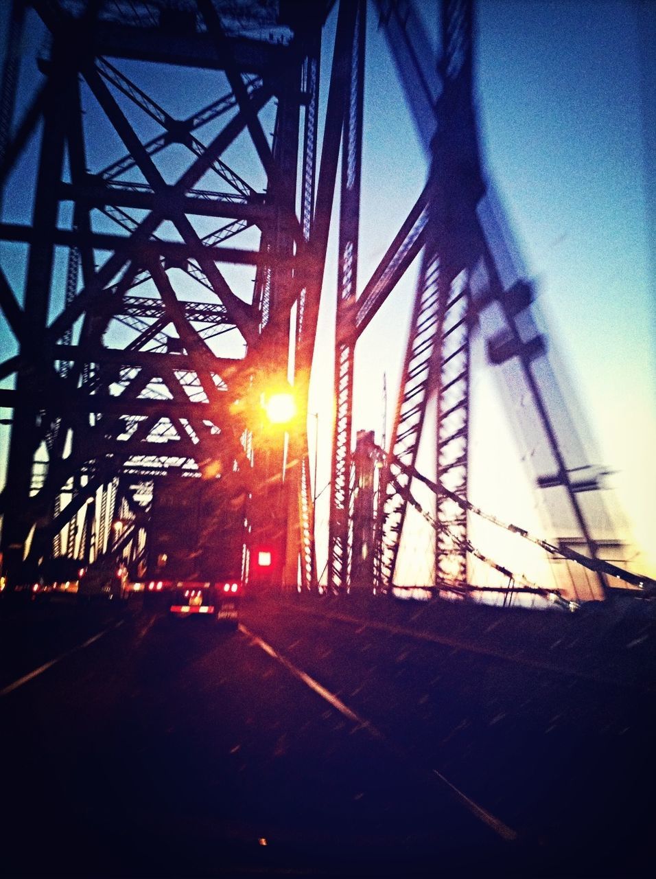transportation, connection, sunset, bridge - man made structure, railroad track, built structure, the way forward, engineering, sky, rail transportation, silhouette, metal, architecture, sun, mode of transport, diminishing perspective, sunlight, electricity pylon, no people, outdoors