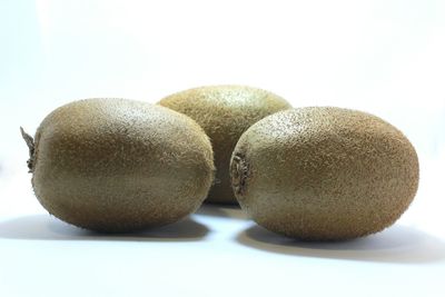 Close-up of fruit over white background