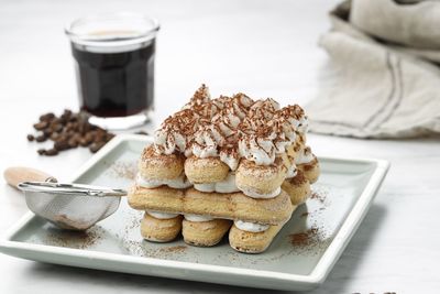 Homemade tiramisu cake. food background, sweet italian dessert, served with black coffee