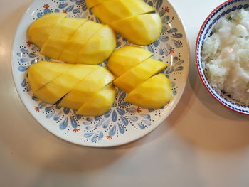 High angle view of fruits in plate on table