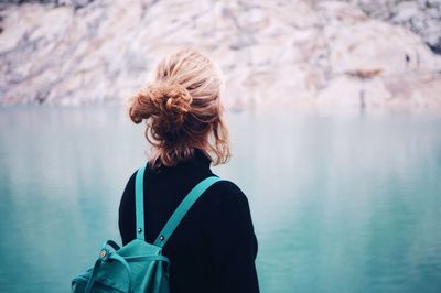 Rear view of woman looking at lake