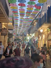 People on street in city at night