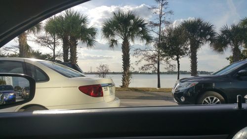 Close-up of car on road against sky