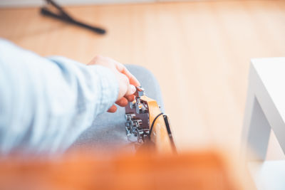 Cropped hand of person holding key