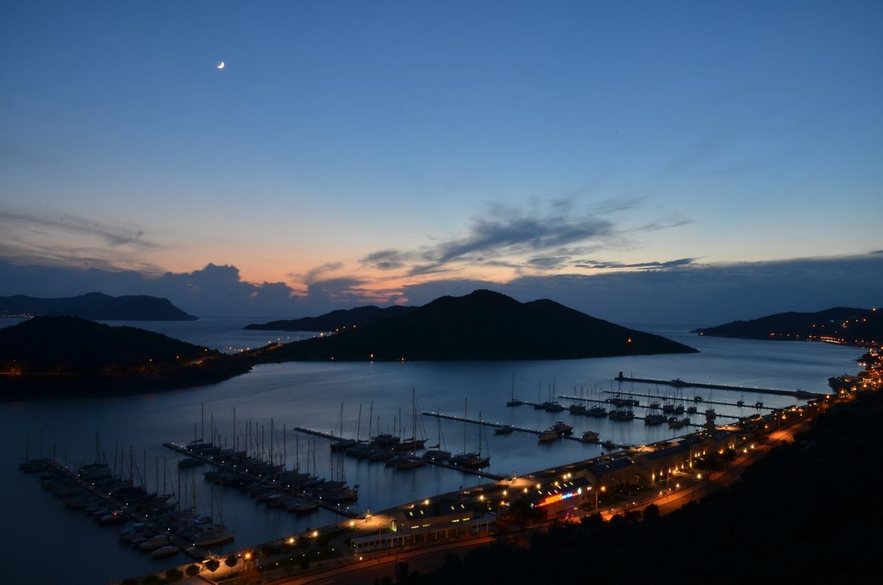 mountain, water, mountain range, sky, harbor, scenics, nautical vessel, illuminated, tranquil scene, dusk, sunset, sea, tranquility, transportation, lake, silhouette, beauty in nature, nature, moored, reflection