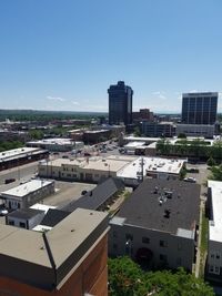 High angle view of townscape against clear blue sky