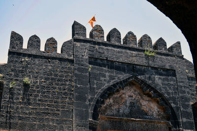 Low angle view of old building against sky