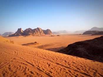 Scenic view of desert against clear sky