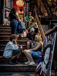 People sitting on staircase