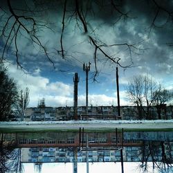 Buildings against cloudy sky