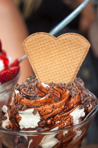 Woman with cup of chocolate ice cream