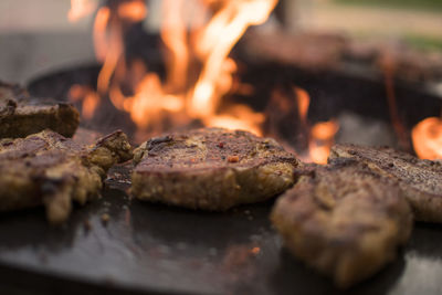 Close-up of meat on barbecue grill