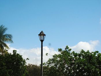 Low angle view of basketball hoop against blue sky