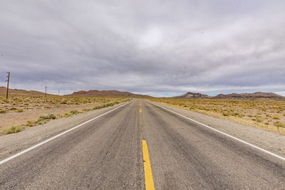 Empty road against sky