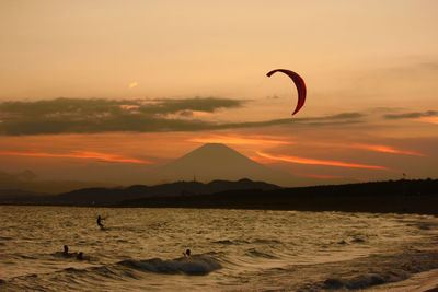 Scenic view of sea against orange sky