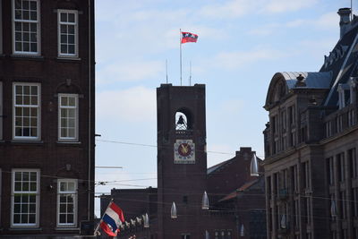 Low angle view of buildings in city against sky