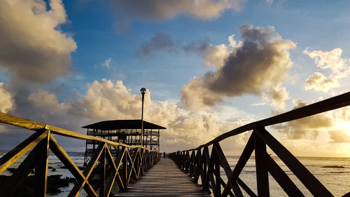 Pier over sea against sky