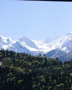 Scenic view of mountains against clear blue sky