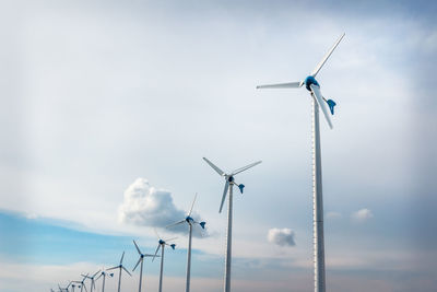 Low angle view of wind turbine against sky