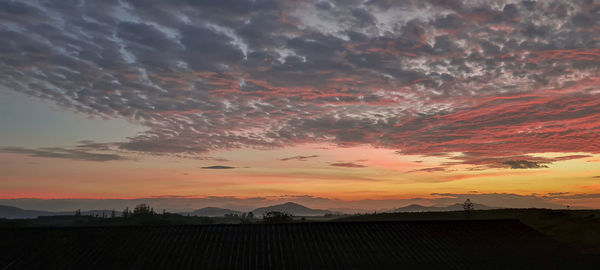 Scenic view of dramatic sky during sunset