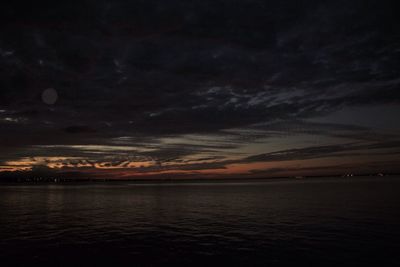 Scenic view of sea against sky at night