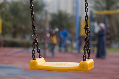 Close-up of swing at playground