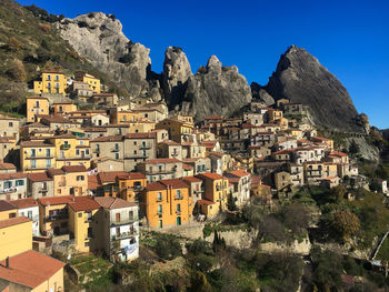 Buildings in town against clear sky