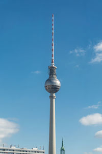 Low angle view of communications tower against sky