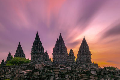 Exterior of temple against sky during sunset