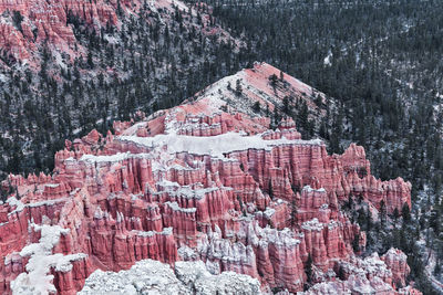 High angle view of rock formations on snow covered land