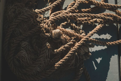 High angle view of old rope on floor