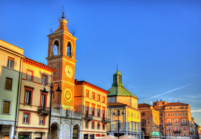 Low angle view of buildings in city against sky