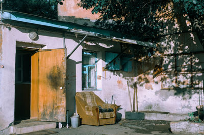 Abandoned house by building