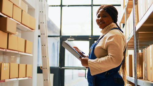Portrait of young woman using mobile phone