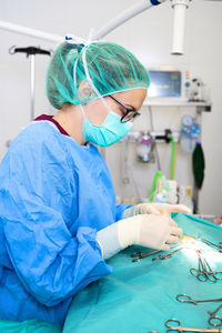 Surgeon performing surgery in hospital