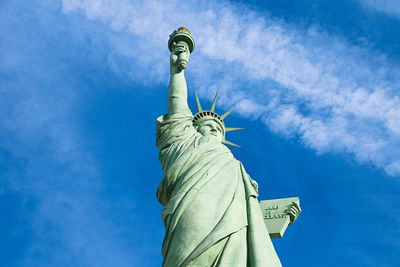 Low angle view of statue against blue sky