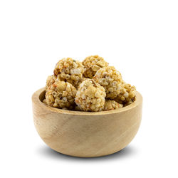 Close-up of bread in bowl against white background