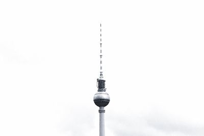 Low angle view of communications tower against sky