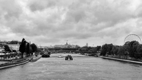 View of bridge over river against cloudy sky