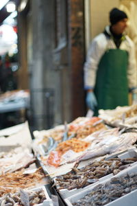 Man preparing food in market