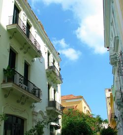 Low angle view of buildings in city against sky