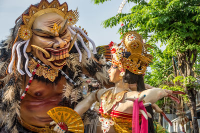 People in traditional clothing sculpture