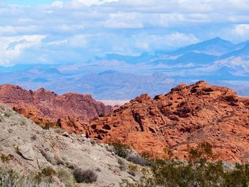 Rock formations on landscape against sky