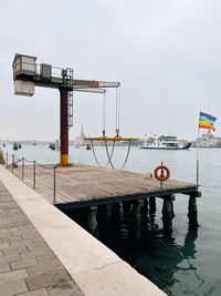 Boats moored at harbor