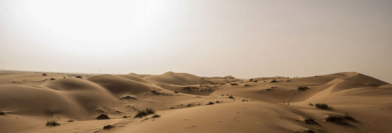 Scenic view of desert against clear sky