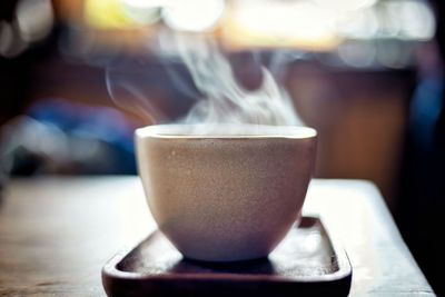Close-up of coffee cup on table